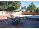 Backyard includes patio seating, rock landscaping, and a basketball court at 4126 Jessica Marie St, North Las Vegas, NV 89032