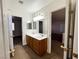 Ensuite bathroom featuring double sinks and mirrors, providing ample space and functionality at 4126 Jessica Marie St, North Las Vegas, NV 89032