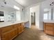 Bright bathroom showcasing dual sinks, marble countertops, and a large mirror at 4126 Jessica Marie St, North Las Vegas, NV 89032
