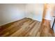 Cozy bedroom with wood-look flooring and a doorway leading to another room at 4126 Jessica Marie St, North Las Vegas, NV 89032