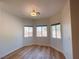 Bright bedroom features wood-look floors and three windows offering plenty of natural light at 4126 Jessica Marie St, North Las Vegas, NV 89032