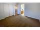 Spacious bedroom with carpet flooring, large closet, and doorway to a bathroom at 4126 Jessica Marie St, North Las Vegas, NV 89032