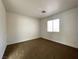 Bedroom featuring carpet flooring, a window with blinds and neutral paint at 4126 Jessica Marie St, North Las Vegas, NV 89032