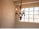 Close-up of a chandelier hanging over a bright window at 4126 Jessica Marie St, North Las Vegas, NV 89032