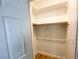 Bright closet features a wooden clothing bar, white shelving, and a wood-look floor at 4126 Jessica Marie St, North Las Vegas, NV 89032