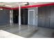 Garage features epoxy flooring, black cabinets, and overhead lighting, offering ample storage at 4126 Jessica Marie St, North Las Vegas, NV 89032