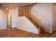 Carpeted staircase with wood railing and white risers in a modern home at 4126 Jessica Marie St, North Las Vegas, NV 89032