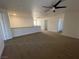 Upstairs landing with carpet flooring, several doors and a view of the chandelier at 4126 Jessica Marie St, North Las Vegas, NV 89032
