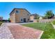 Exterior showcasing backyard with turf, gravel, and brick-paved sections at 4206 Topaz Hills Dr, North Las Vegas, NV 89032