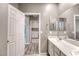Bright bathroom with double vanity and a door leading to another room at 4206 Topaz Hills Dr, North Las Vegas, NV 89032