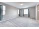 Bright bedroom with large windows and neutral carpeting at 4206 Topaz Hills Dr, North Las Vegas, NV 89032