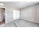 Bedroom with new carpet, white closet doors, and light gray paint at 4206 Topaz Hills Dr, North Las Vegas, NV 89032