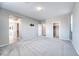 Spacious bedroom featuring soft carpet, walk-in closet, and bathroom access at 4206 Topaz Hills Dr, North Las Vegas, NV 89032