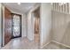 Inviting foyer with decorative front door and tile flooring at 4206 Topaz Hills Dr, North Las Vegas, NV 89032