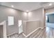 Hallway with hardwood flooring, natural light, and neutral paint at 4206 Topaz Hills Dr, North Las Vegas, NV 89032