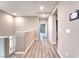 Upstairs hallway with hardwood flooring, recessed lighting and neutral paint at 4206 Topaz Hills Dr, North Las Vegas, NV 89032