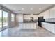 Spacious kitchen featuring a center island, white cabinetry, and stainless steel appliances at 4206 Topaz Hills Dr, North Las Vegas, NV 89032