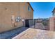 Side yard featuring a secure gate and low-maintenance desert landscaping at 4206 Topaz Hills Dr, North Las Vegas, NV 89032