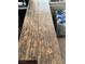 Close up of planks of laminate flooring with a wood grain texture at 4444 Denia Cir, Las Vegas, NV 89108
