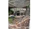 Covered patio area with stone pavers, a built-in grill, and outdoor seating at 4444 Denia Cir, Las Vegas, NV 89108