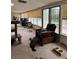 Bright sunroom with large windows, comfortable seating, and space for cat trees at 4444 Denia Cir, Las Vegas, NV 89108