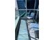 Stylish outdoor balcony with chairs providing an inviting space to relax and enjoy city views at 4525 Dean Martin Dr # 2203, Las Vegas, NV 89103