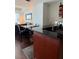 Stylish kitchenette featuring dark countertops and wood flooring adjacent to a comfortable living area at 4525 Dean Martin Dr # 2203, Las Vegas, NV 89103