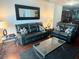 Chic living room featuring leather furniture, hardwood floors, and a modern glass coffee table at 4525 Dean Martin Dr # 2203, Las Vegas, NV 89103