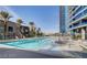 Outdoor community pool with lounge chairs and city views at 4525 Dean Martin Dr # 2203, Las Vegas, NV 89103