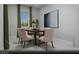 Elegant dining room featuring neutral walls, modern art, and a stylish table with seating for six at 4720 Tindra Ave # Lot 16, Las Vegas, NV 89121
