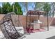 Outdoor space features a hanging chair and covered grill, perfect for entertaining at 5234 Tulip Hill Ave, Las Vegas, NV 89141