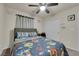 Cozy bedroom with bed, ceiling fan, and closet, offering a relaxing private space at 5234 Tulip Hill Ave, Las Vegas, NV 89141