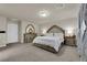 Spacious bedroom with luxurious bed, neutral carpet, and elegant furniture at 5234 Tulip Hill Ave, Las Vegas, NV 89141