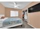 Comfortable bedroom with a ceiling fan, closet, and soft natural lighting at 5234 Tulip Hill Ave, Las Vegas, NV 89141