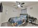 Comfortable bedroom with a themed bed, ceiling fan, desk, and carpeted floor at 5234 Tulip Hill Ave, Las Vegas, NV 89141