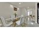 Dining room featuring modern chairs, glass-top table, and contemporary decor at 5234 Tulip Hill Ave, Las Vegas, NV 89141