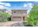 Charming two-story home with a large two-car garage and beautiful desert landscaping at 5234 Tulip Hill Ave, Las Vegas, NV 89141