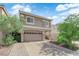 Charming two-story home with a large two-car garage and lovely desert landscaping at 5234 Tulip Hill Ave, Las Vegas, NV 89141