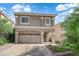 Inviting two-story home with a two-car garage and well-maintained desert landscaping at 5234 Tulip Hill Ave, Las Vegas, NV 89141