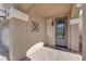 Covered front porch with decorative door, brick pavers, and attractive exterior lighting at 5234 Tulip Hill Ave, Las Vegas, NV 89141