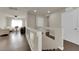Cozy loft featuring wood floors and a view of the home's entryway and downstairs living area at 5234 Tulip Hill Ave, Las Vegas, NV 89141