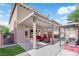Covered patio has comfortable seating and a grill, perfect for outdoor dining at 5234 Tulip Hill Ave, Las Vegas, NV 89141