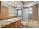 Bright bathroom features granite counters, mosaic backsplash, and a glass enclosed shower-tub combination at 5401 Broadwater Ln, Las Vegas, NV 89130