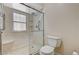 Updated bathroom showcasing a glass-enclosed shower with seating and modern fixtures at 5401 Broadwater Ln, Las Vegas, NV 89130