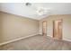 Neutral bedroom boasting vaulted ceiling with fan, ensuite bathroom, and walk-in closet at 5401 Broadwater Ln, Las Vegas, NV 89130