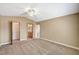Spacious bedroom featuring a walk-in closet and neutral carpeting throughout at 5401 Broadwater Ln, Las Vegas, NV 89130