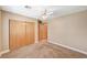 Carpeted bedroom features closet with double doors and an attached bathroom at 5401 Broadwater Ln, Las Vegas, NV 89130