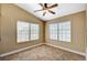 Cozy bedroom with a ceiling fan and windows at 5401 Broadwater Ln, Las Vegas, NV 89130