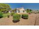 Exterior view of a one-story home boasting a desert-style landscape at 5401 Broadwater Ln, Las Vegas, NV 89130