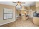 Open kitchen and living room with natural light and modern appliances at 5401 Broadwater Ln, Las Vegas, NV 89130